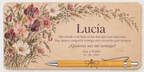 Plywood plaque printed in colour with wildflowers, the name Lucía and a bamboo pen