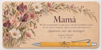 Plaque printed in colour with wildflowers, the text Mamá and a bamboo pen