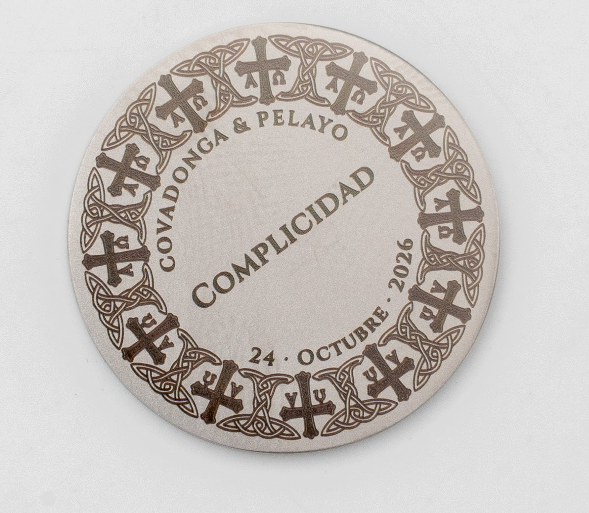 Wedding coin with a design of Asturian crosses and Celtic knots around the edge.