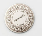 Castilian wedding coin engraved with castles, windmills and medieval knights.