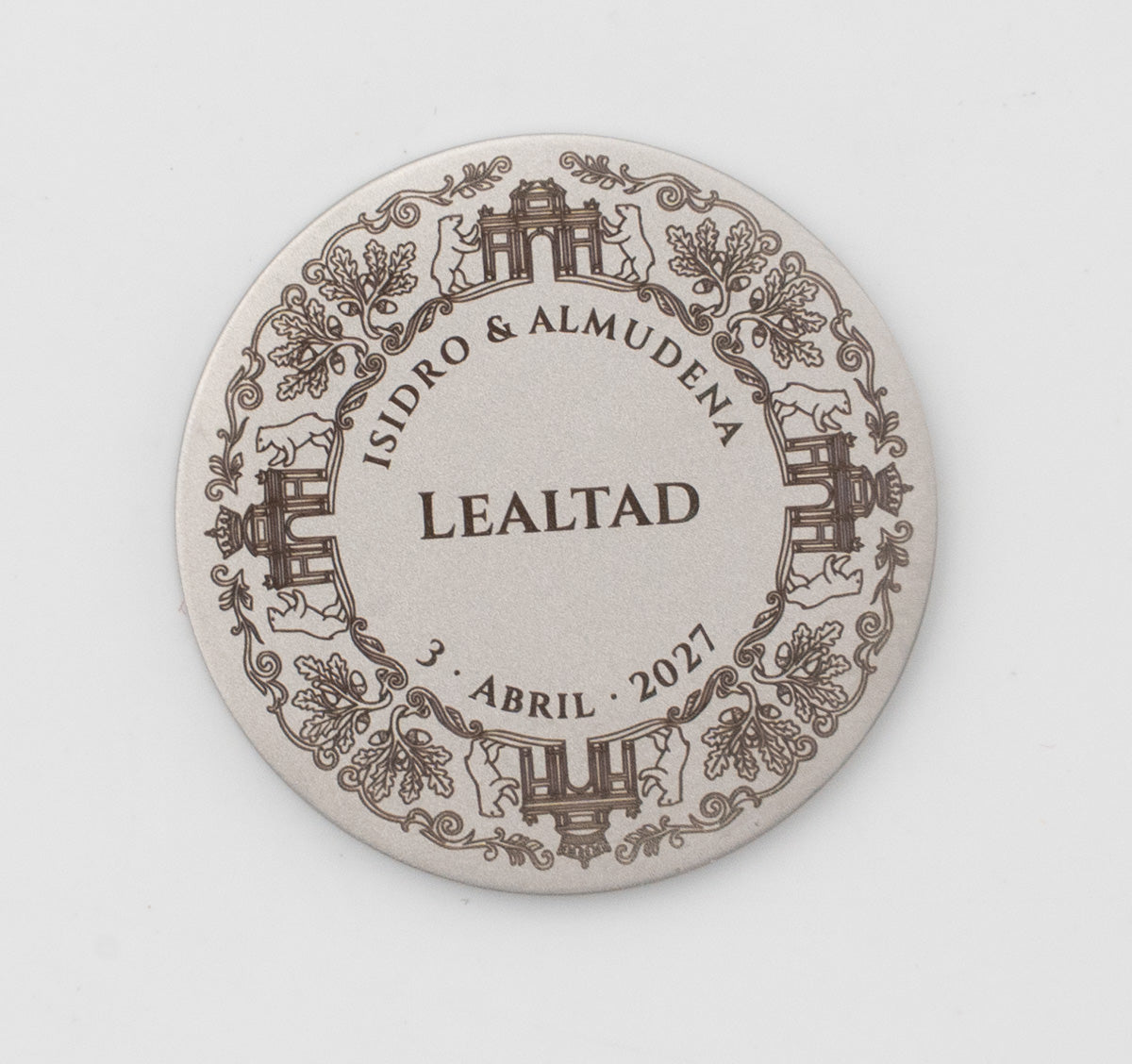 Madrid coin engraved with the Bear and the Strawberry Tree and the Puerta de Alcalá.