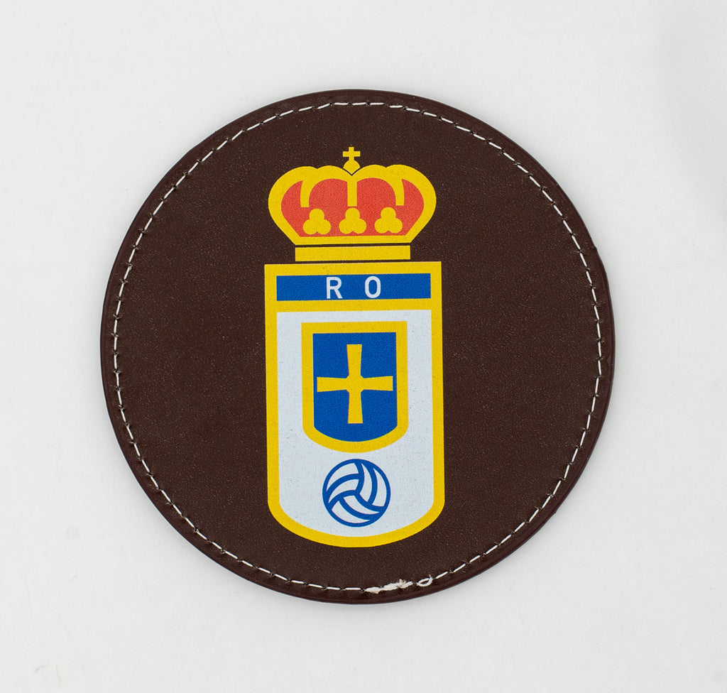 Round brown coaster with a colour football crest.