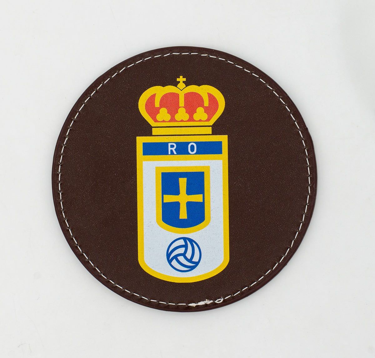 Round brown coaster with a colour football crest.