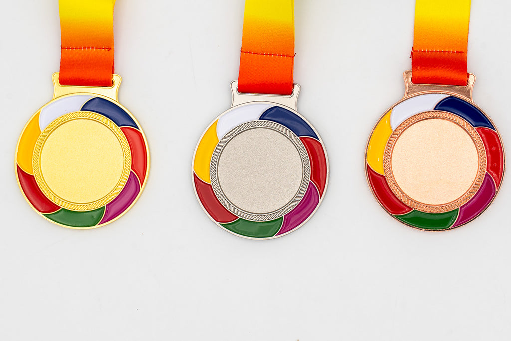 Medals with multicoloured curved blades and red and yellow ribbons.