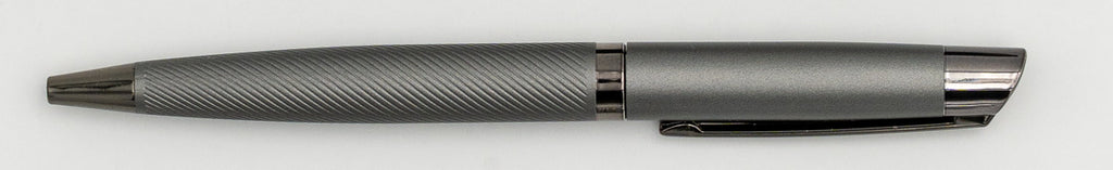 Grey metal pen with a smooth upper section and diagonal line barrel pattern.