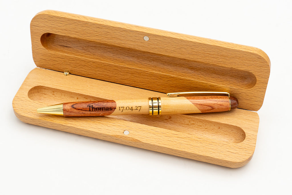 Open case with a two-tone wooden pen and engraved name.
