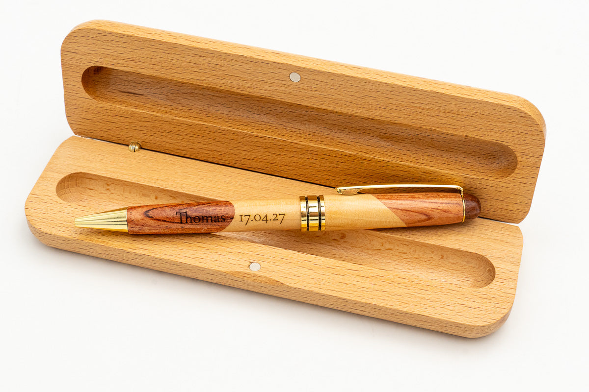 Open case with a two-tone wooden pen and engraved name.