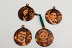 Four flat ornaments with crochet-style portraits and Nativity scenes.