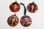 Four flat ornaments with 3D animated characters and a Santa Claus background.