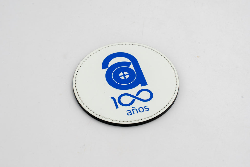 Round white coaster with a blue centenary logo.
