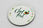 Round white coaster with Chef Fruit branding and colour fruit illustrations.