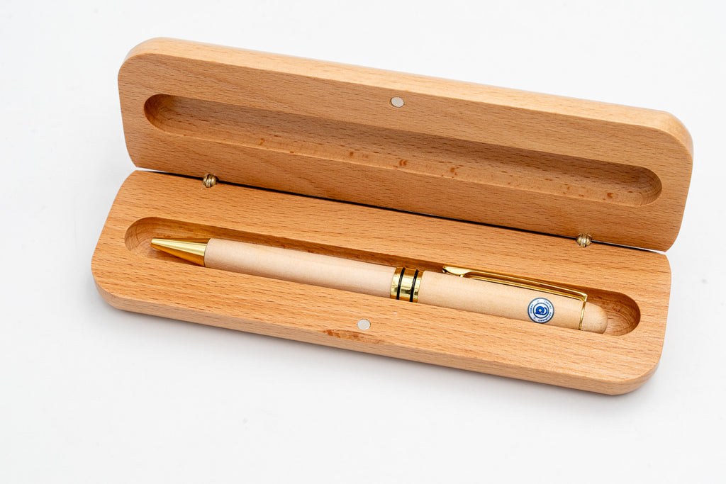 Open case with a light pen and a coloured circular emblem.