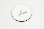 Round white coaster with a grey Chevalier logo.