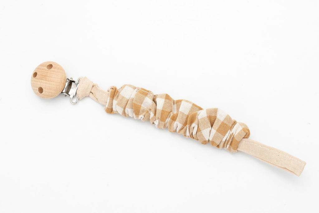 Gathered fabric dummy clip with beige and white gingham and a wooden clip