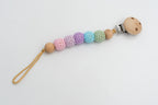 Dummy clip with pastel crochet-covered beads and a wooden clip