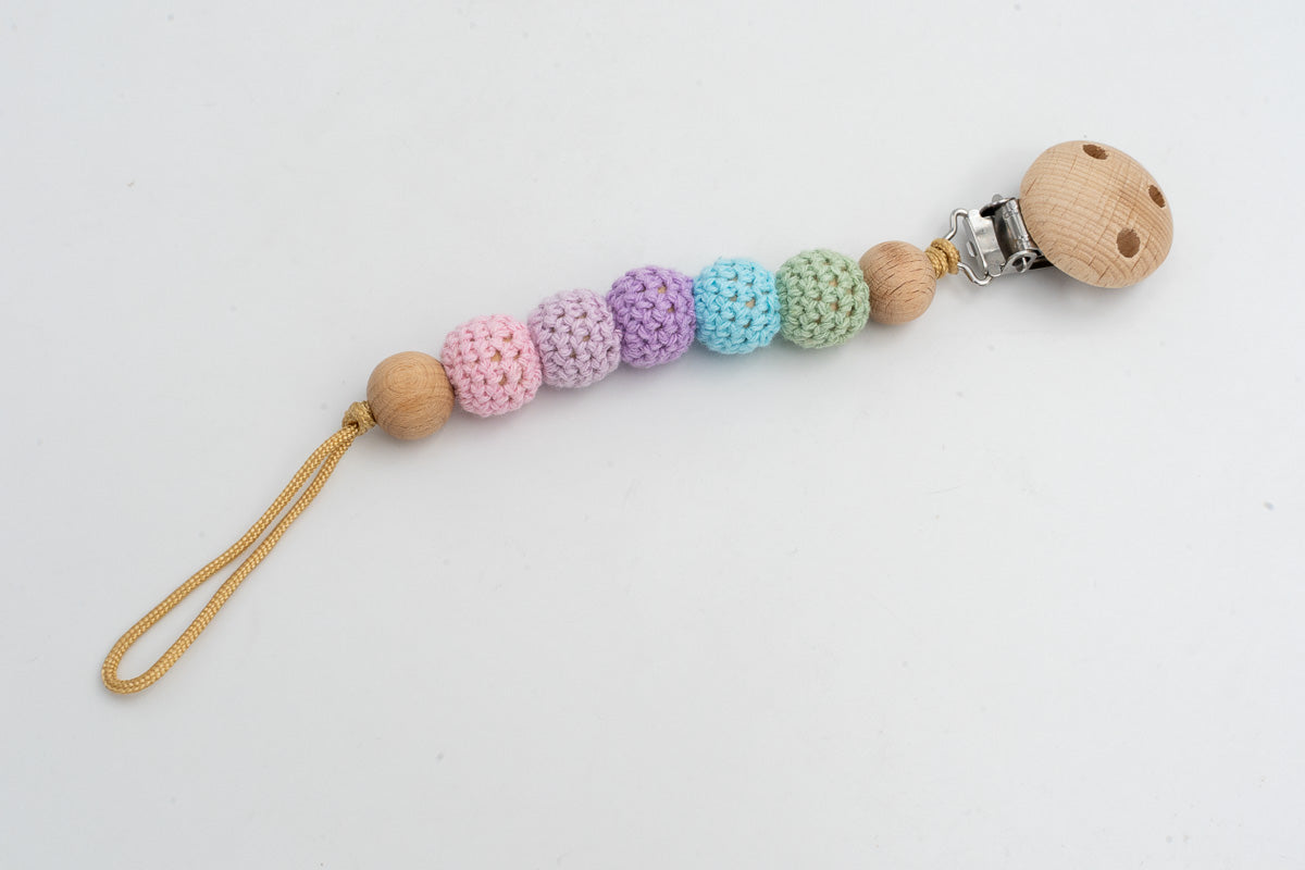 Dummy clip with pastel crochet-covered beads and a wooden clip
