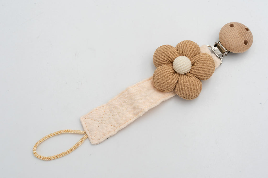 Fabric dummy clip with a camel flower with a light centre and a wooden clip