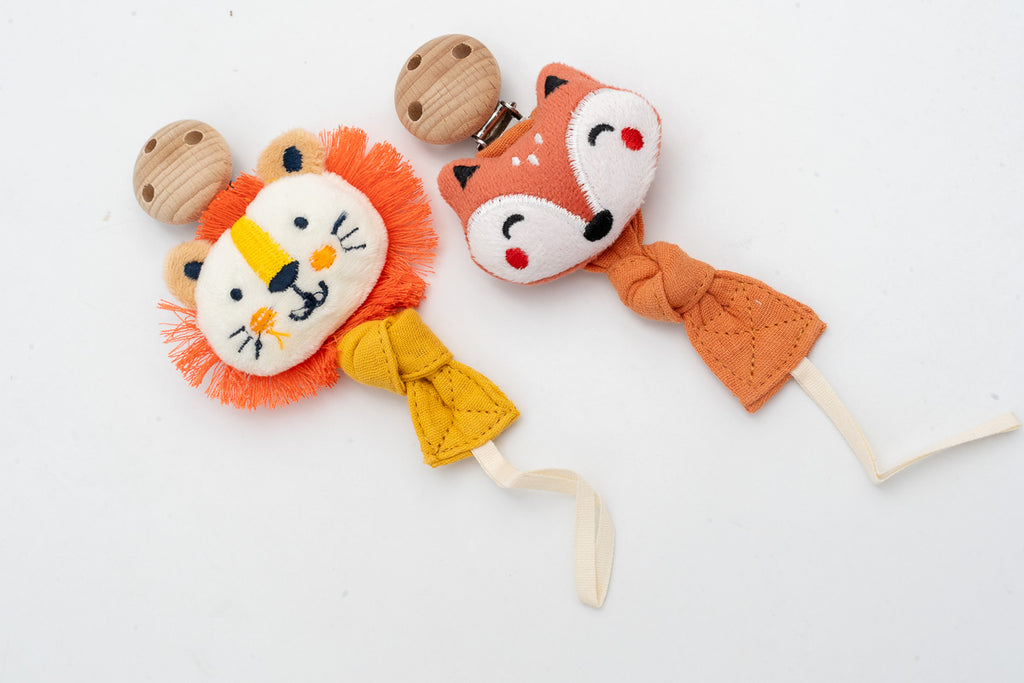 Fabric dummy clips with lion and fox faces and wooden clips
