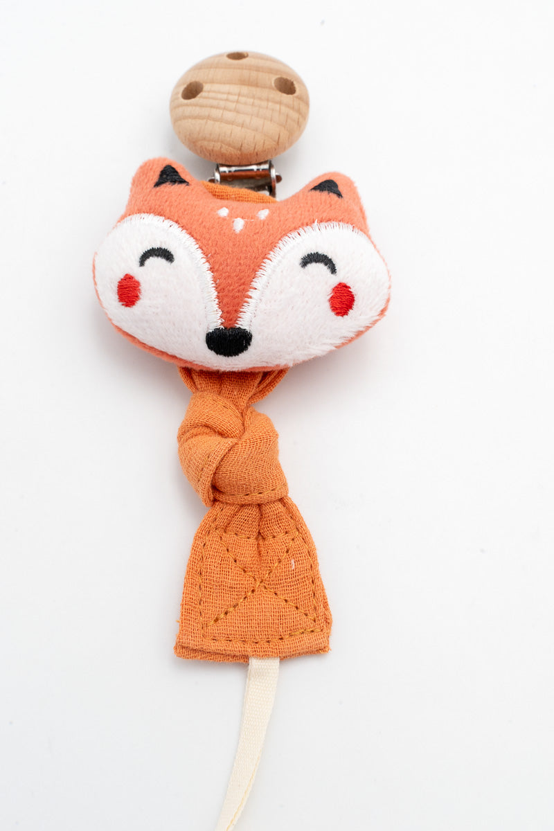 Orange fabric dummy clip with a fox face and a wooden clip