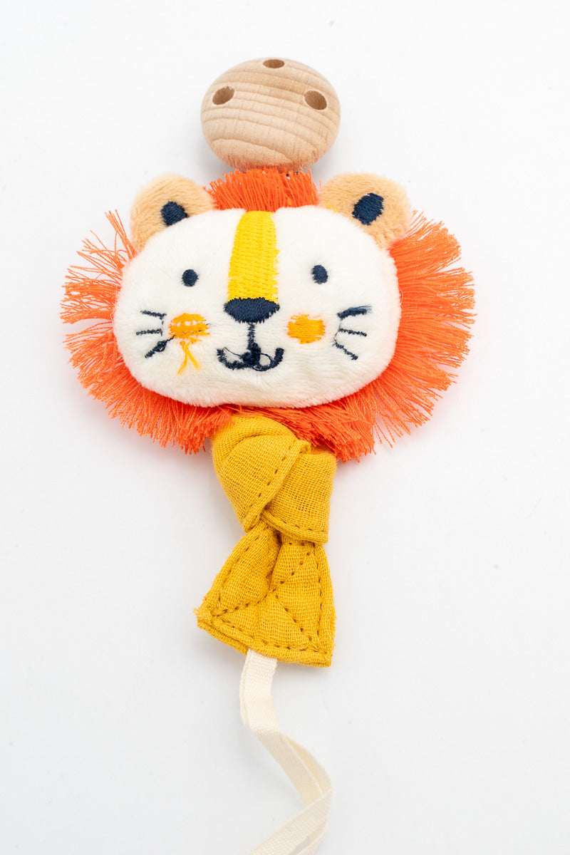 Yellow fabric dummy clip with a lion face and orange mane beside the wooden clip