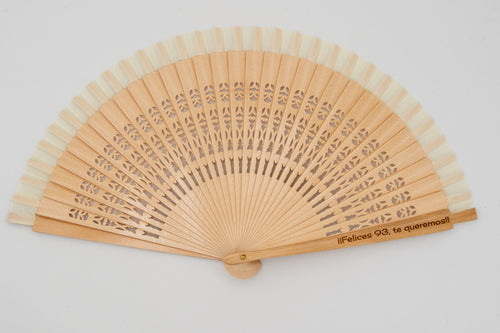 Openwork wood fan with text engraved on the outer guard stick