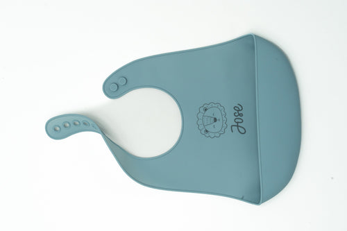 Dark green silicone bib with a name and animal face drawing.