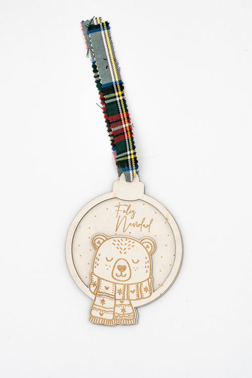 Two-layer wooden ornament with a bear wearing a scarf and green checked ribbon.