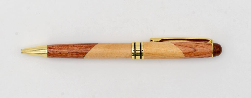 Two-tone wooden pen with diagonal joins and gold-coloured details.