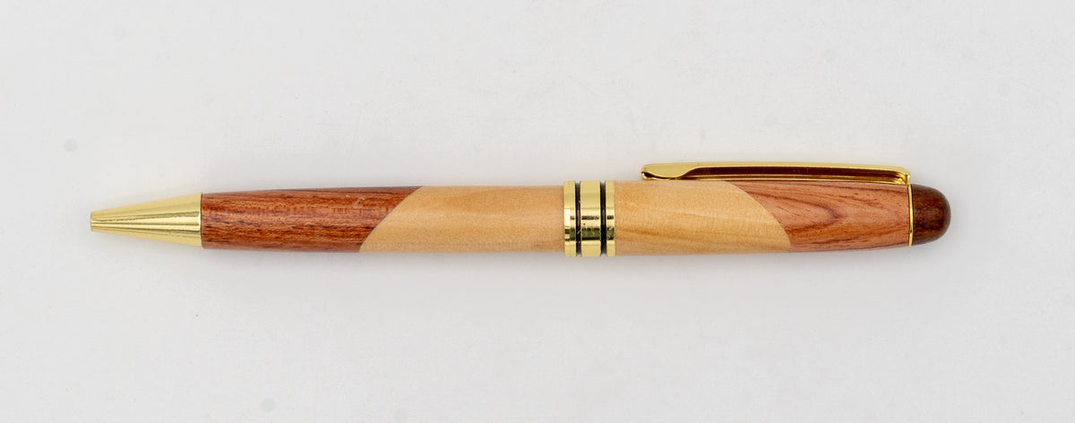 Two-tone wooden pen with diagonal joins and gold-coloured details.