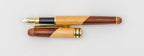 Side view of a two-tone wooden fountain pen with nib and cap with a gold-coloured clip.