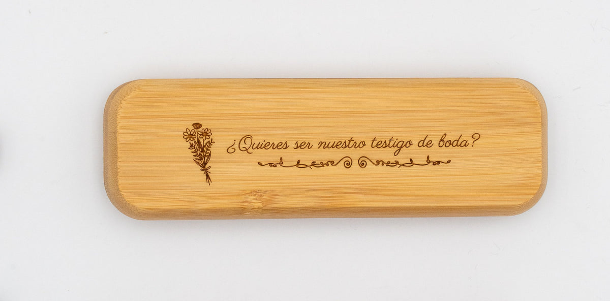 Example of a bamboo case with an engraved question for a wedding witness and flowers.