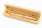 Presentation example of a pale wooden pen with gold-coloured details in an open case engraved for a wedding witness.
