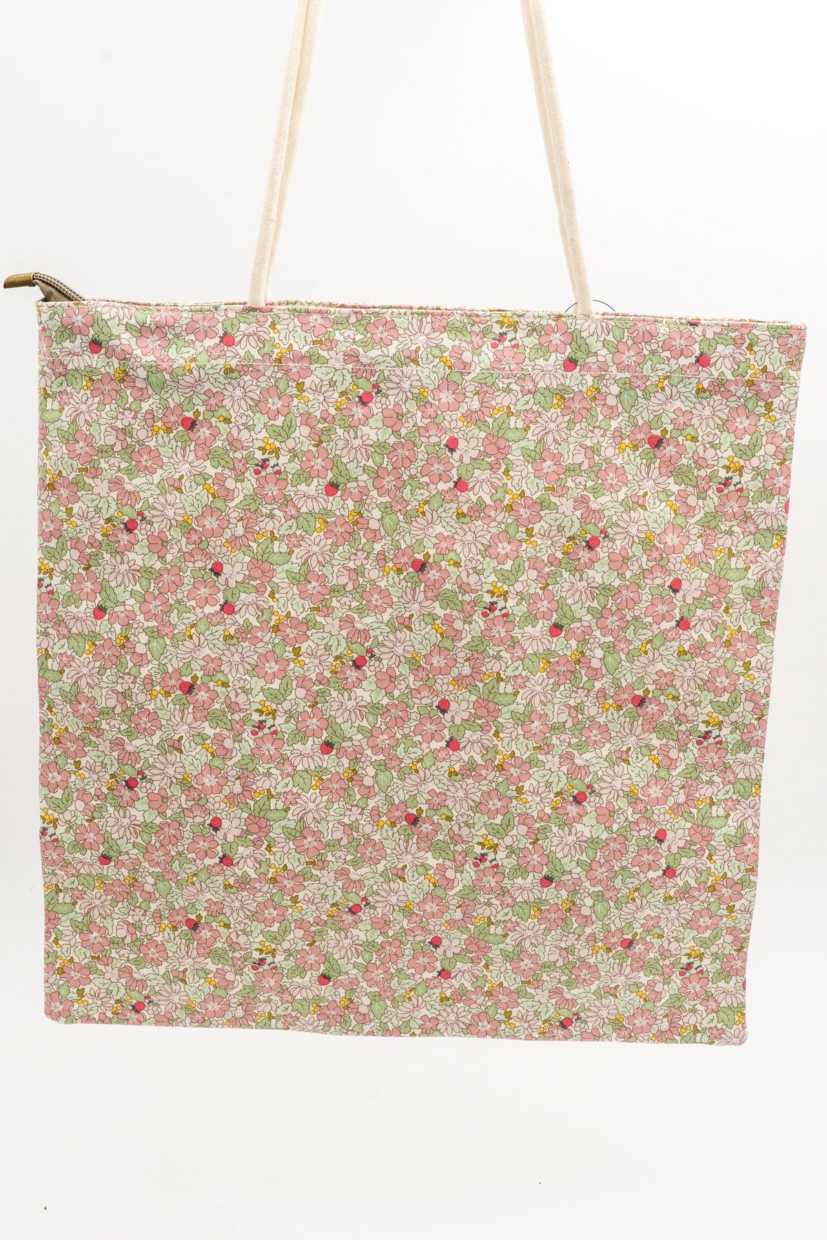 Fabric tote bag with pink floral print and white rope handles