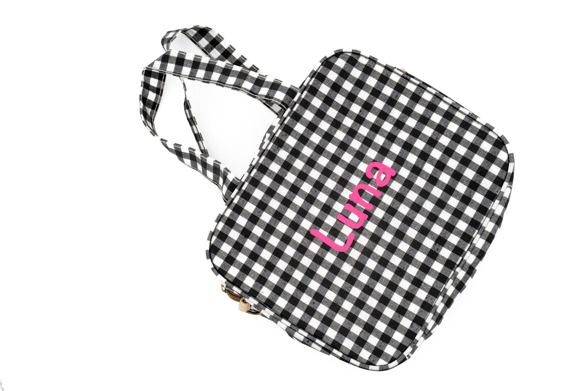 Black gingham change bag with the name Luna in pink vinyl
