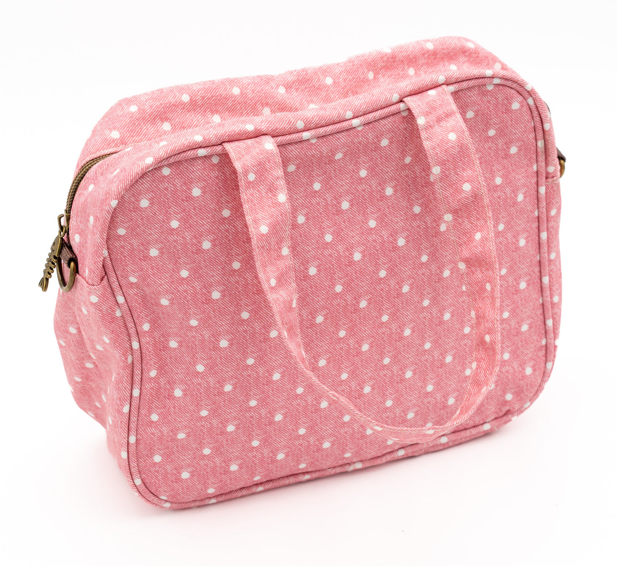 Pink change bag with white polka dots