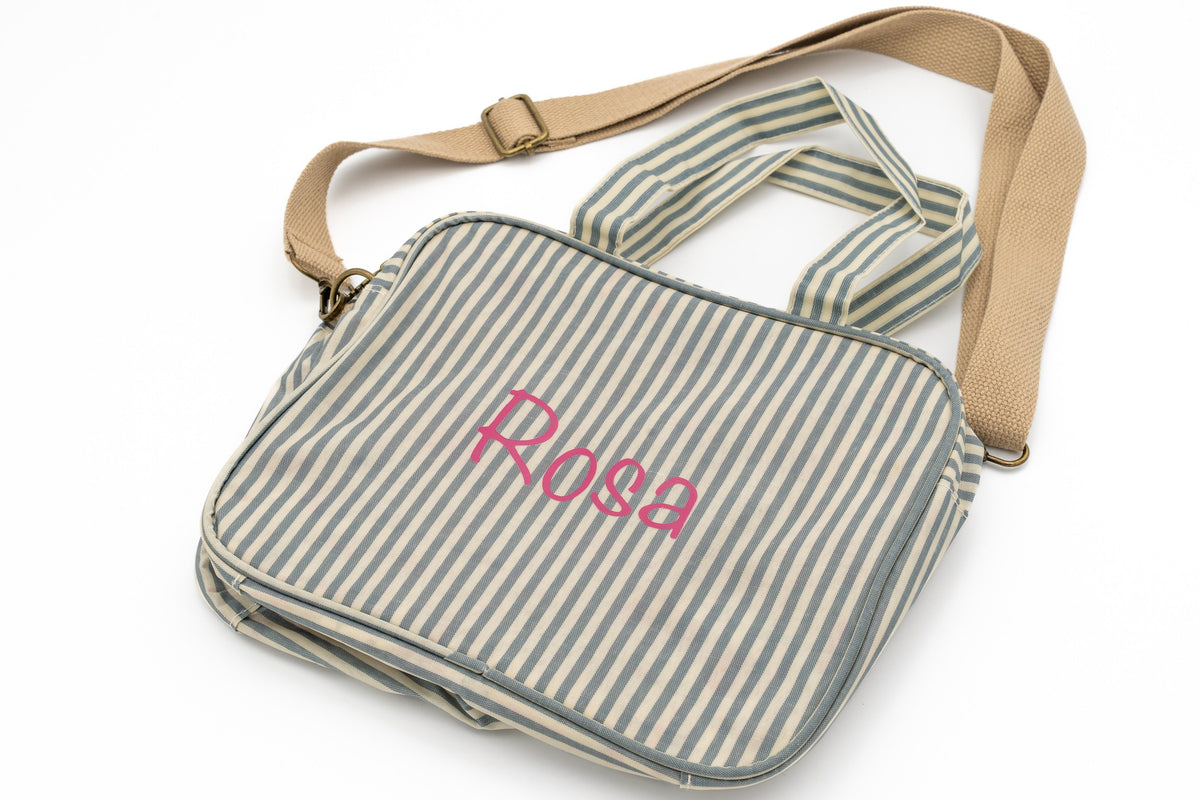 Green striped change bag with the name Rosa in pink vinyl
