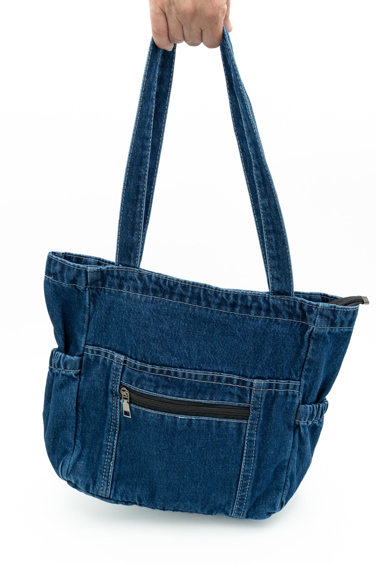 Denim bag with elasticated side pockets and a front pocket with a horizontal zip