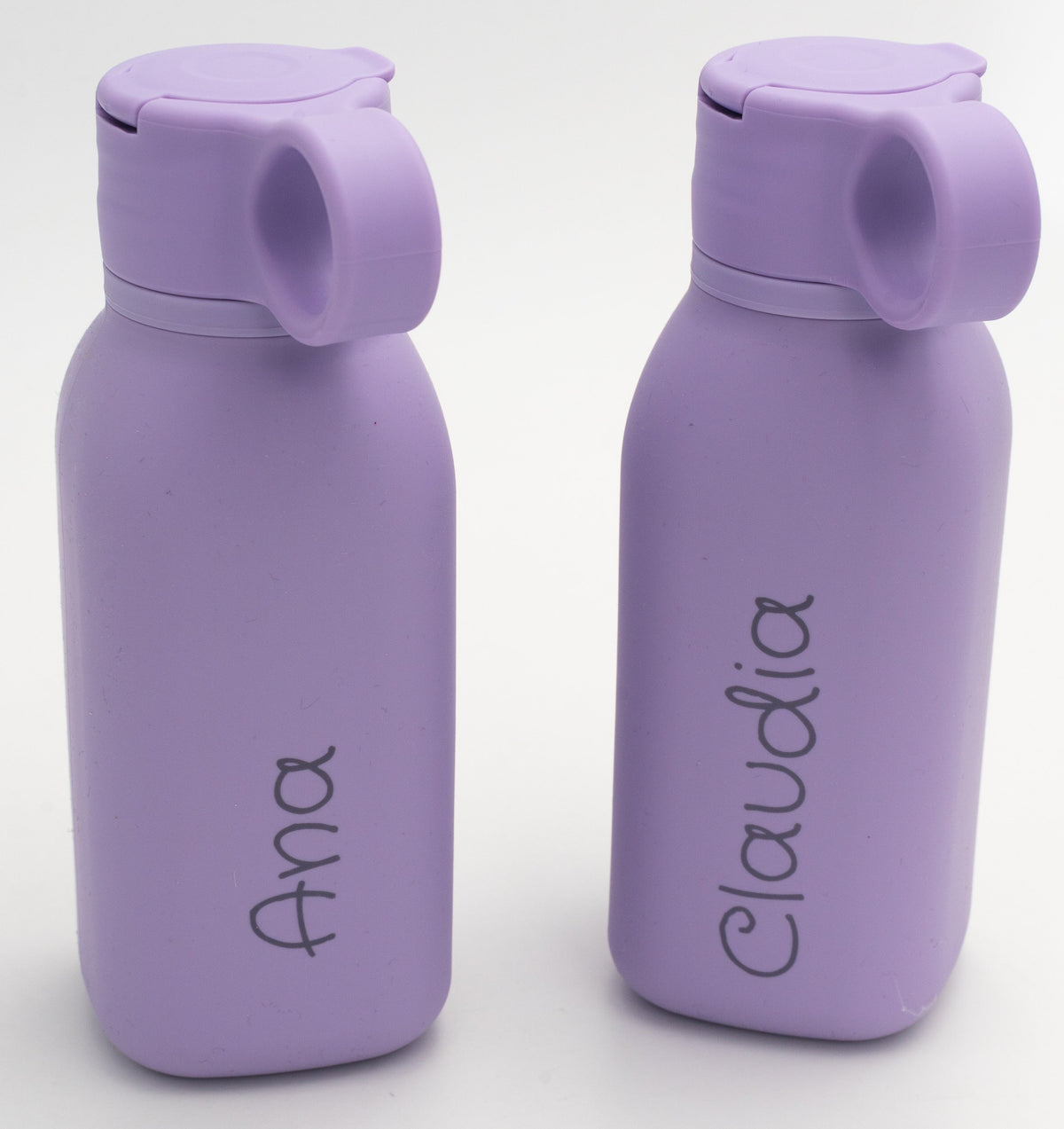 Two lilac bottles personalised with different names