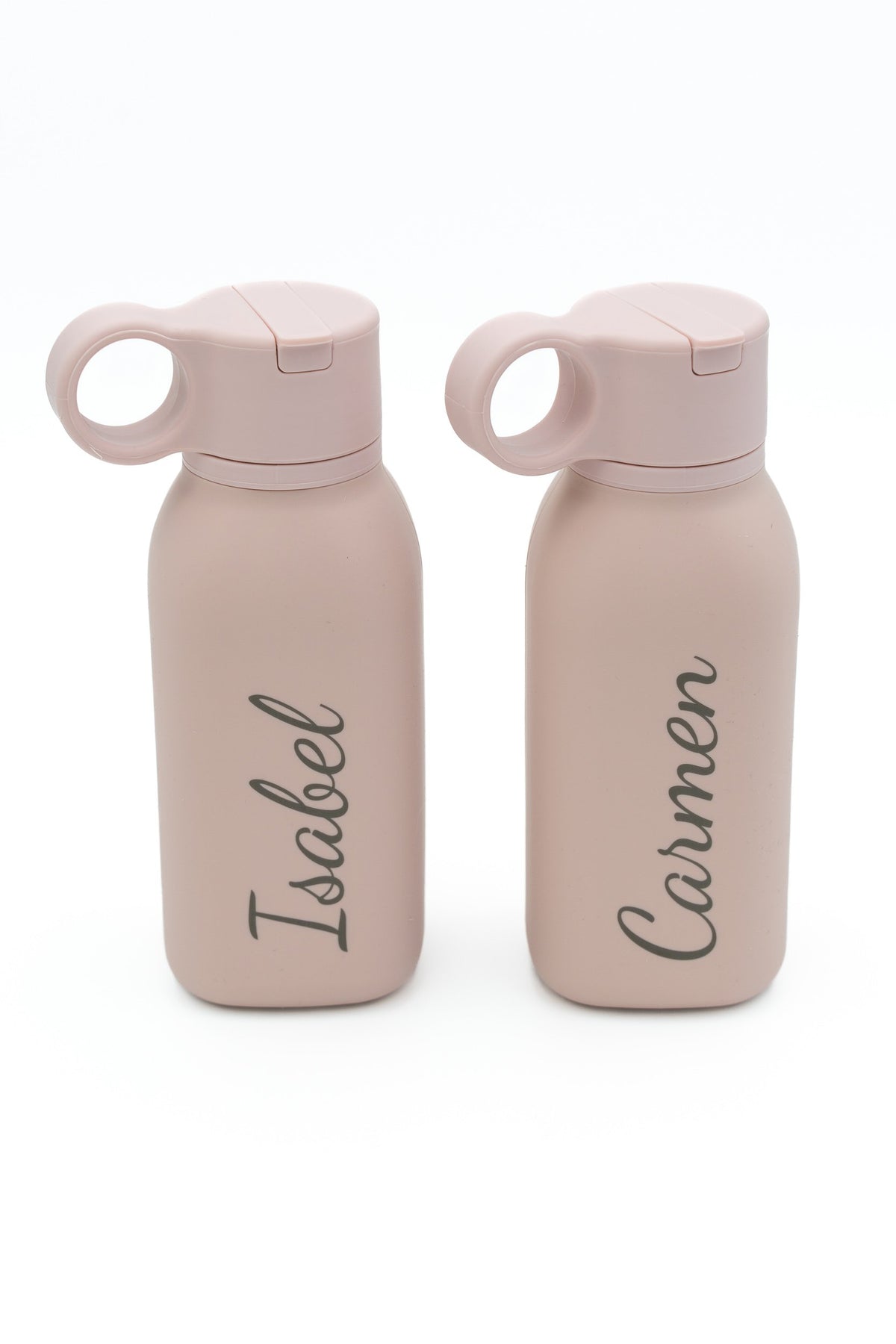 Two pink bottles with engraved names