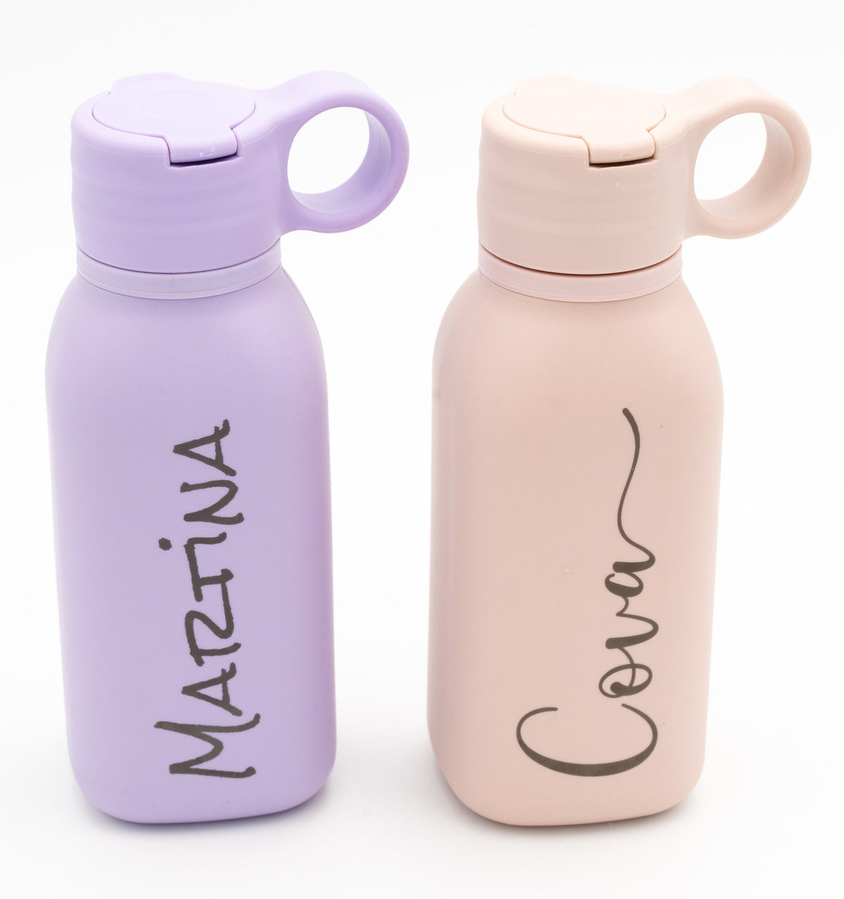 Two lilac and light pink bottles with engraved names