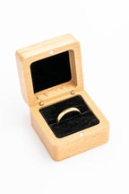 Open square ring box with a white interior