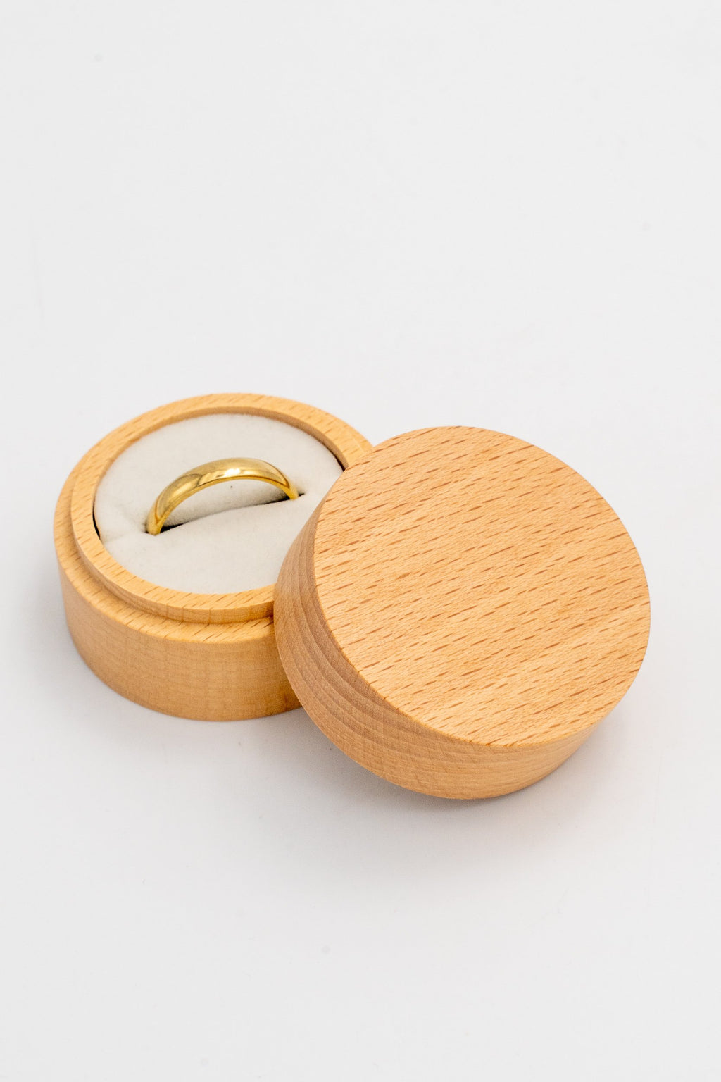 Open round ring box with a white interior
