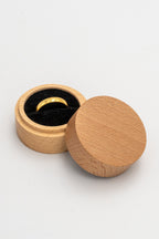 Open round ring box with a black interior