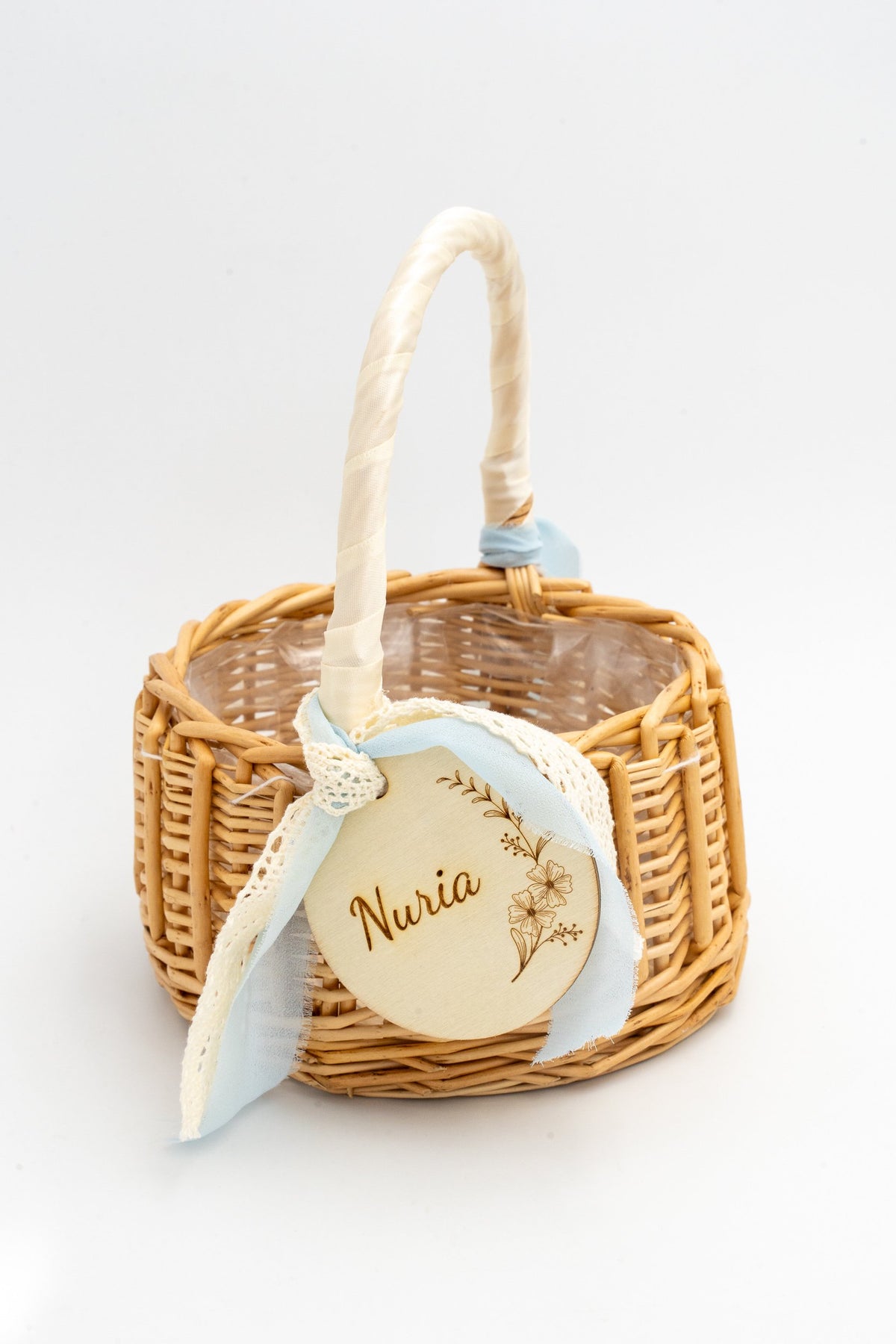 Corpus Christi basket with a wrapped handle and decorative blue lace ribbon.