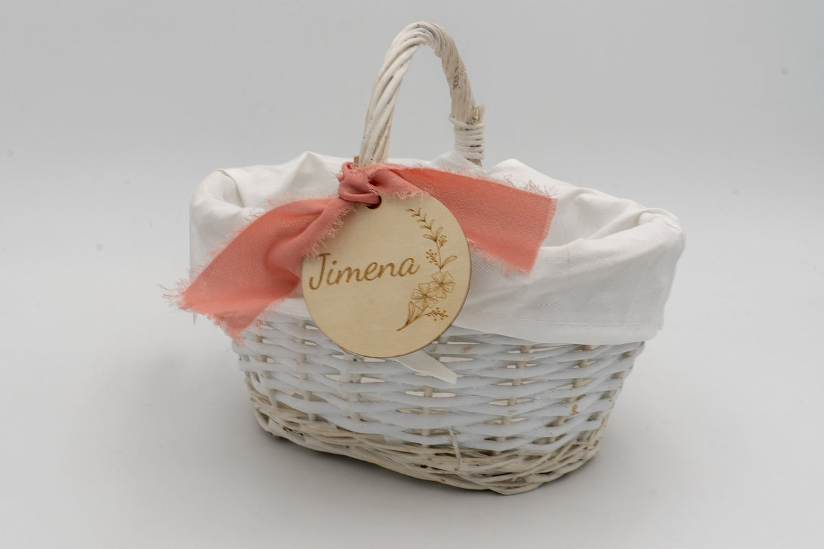 White basket with white lining, coral bow and the name Jimena