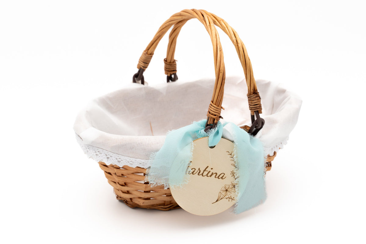 Oval flower basket with white fabric lining and a soft blue bow