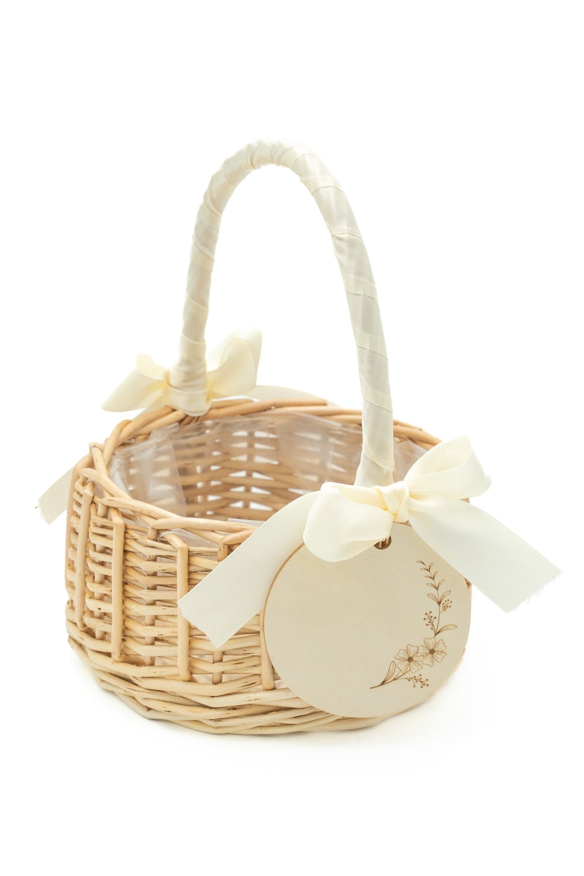 Rattan basket with a cream bow and a disc with the name Martina