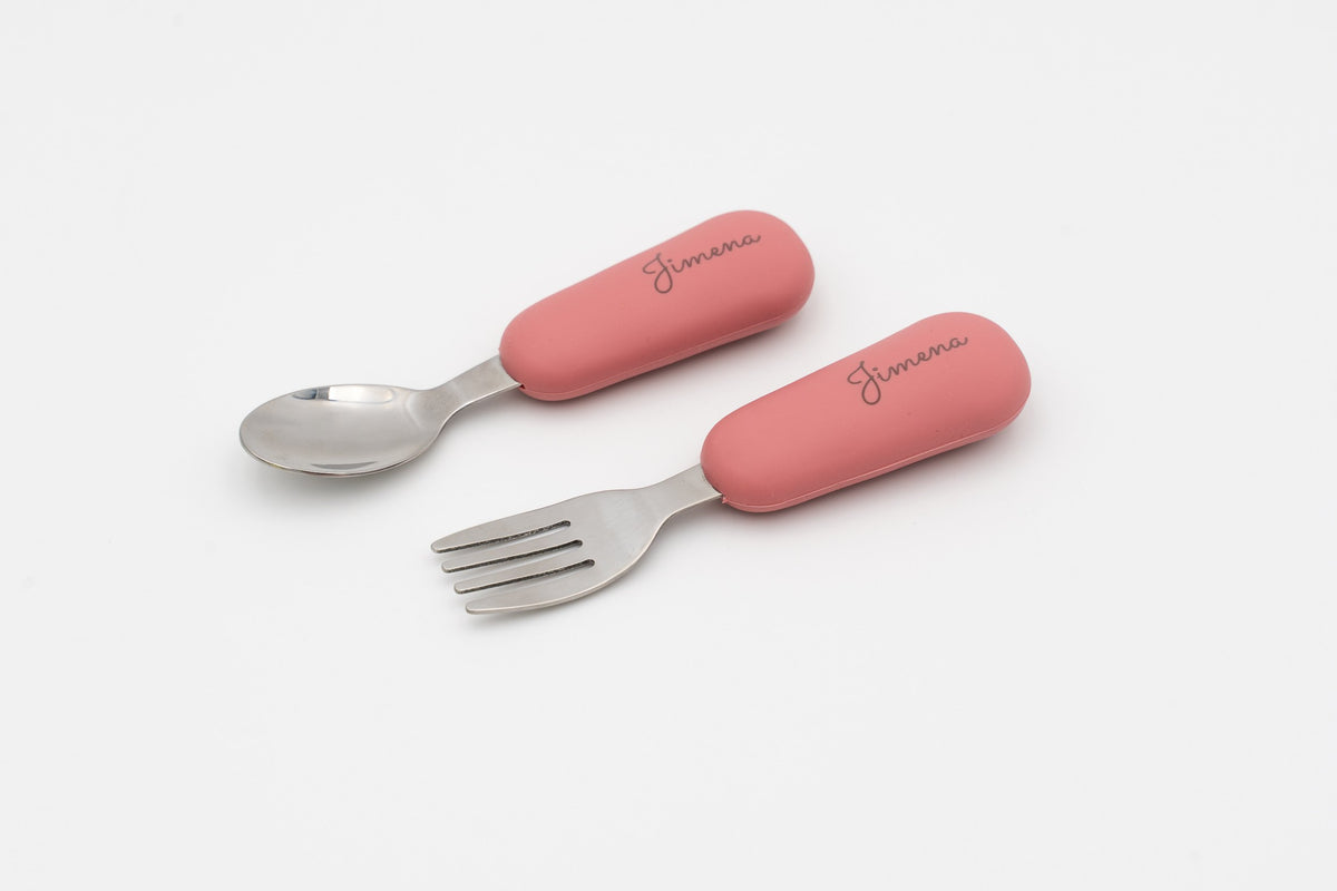 Pink spoon and fork with names on the handles