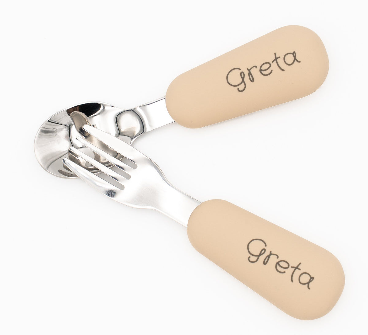 Beige spoon and fork set with the name Greta