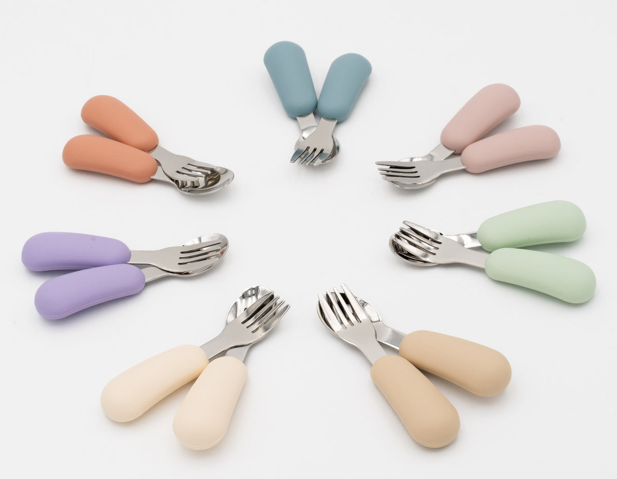 Children's spoon and fork sets with silicone handles in various colours